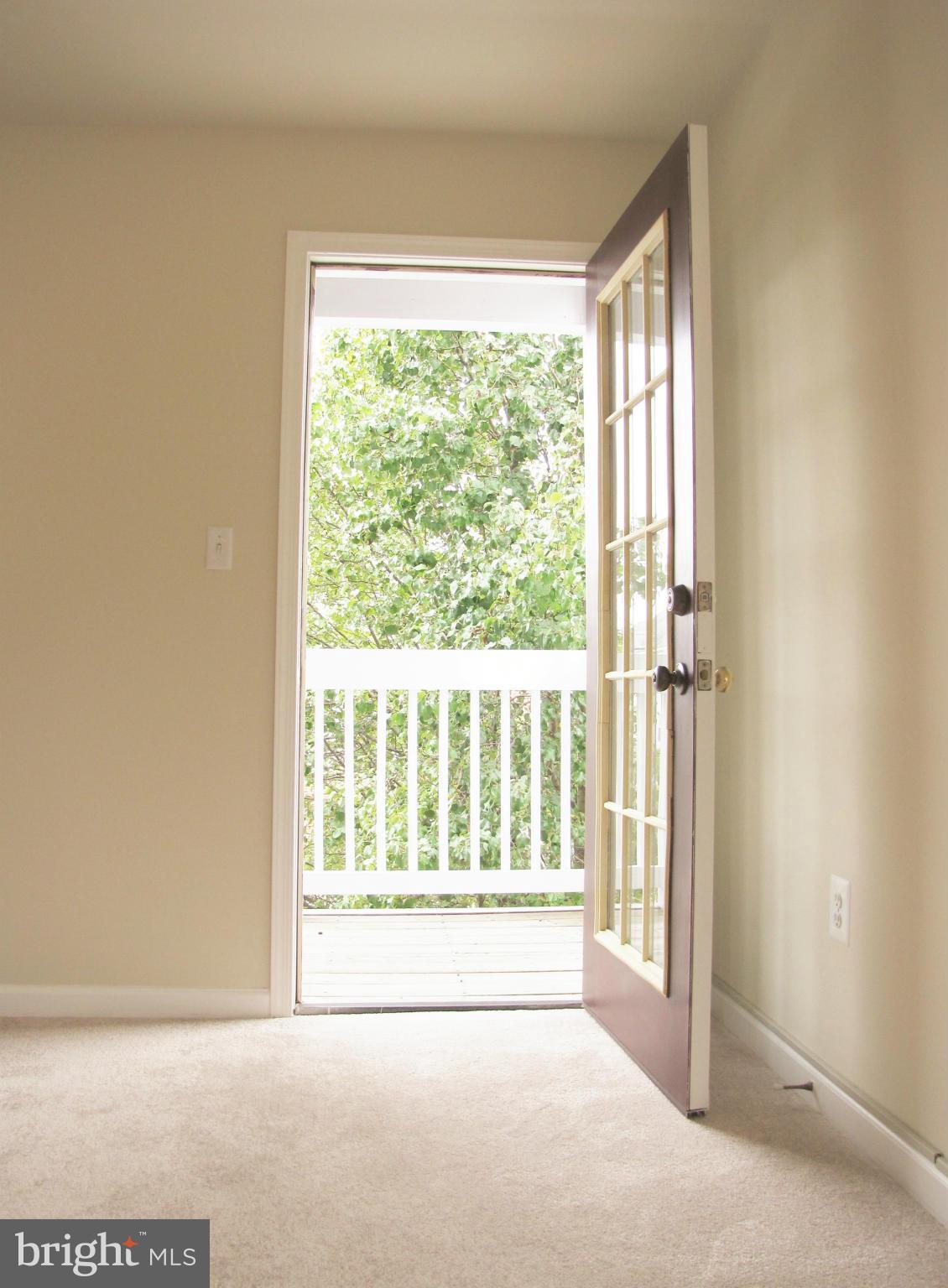 635 Constellation Square Southeast, Unit E Leesburg, VA 20175 - Photo 17 of 20 a view of an empty room with a window