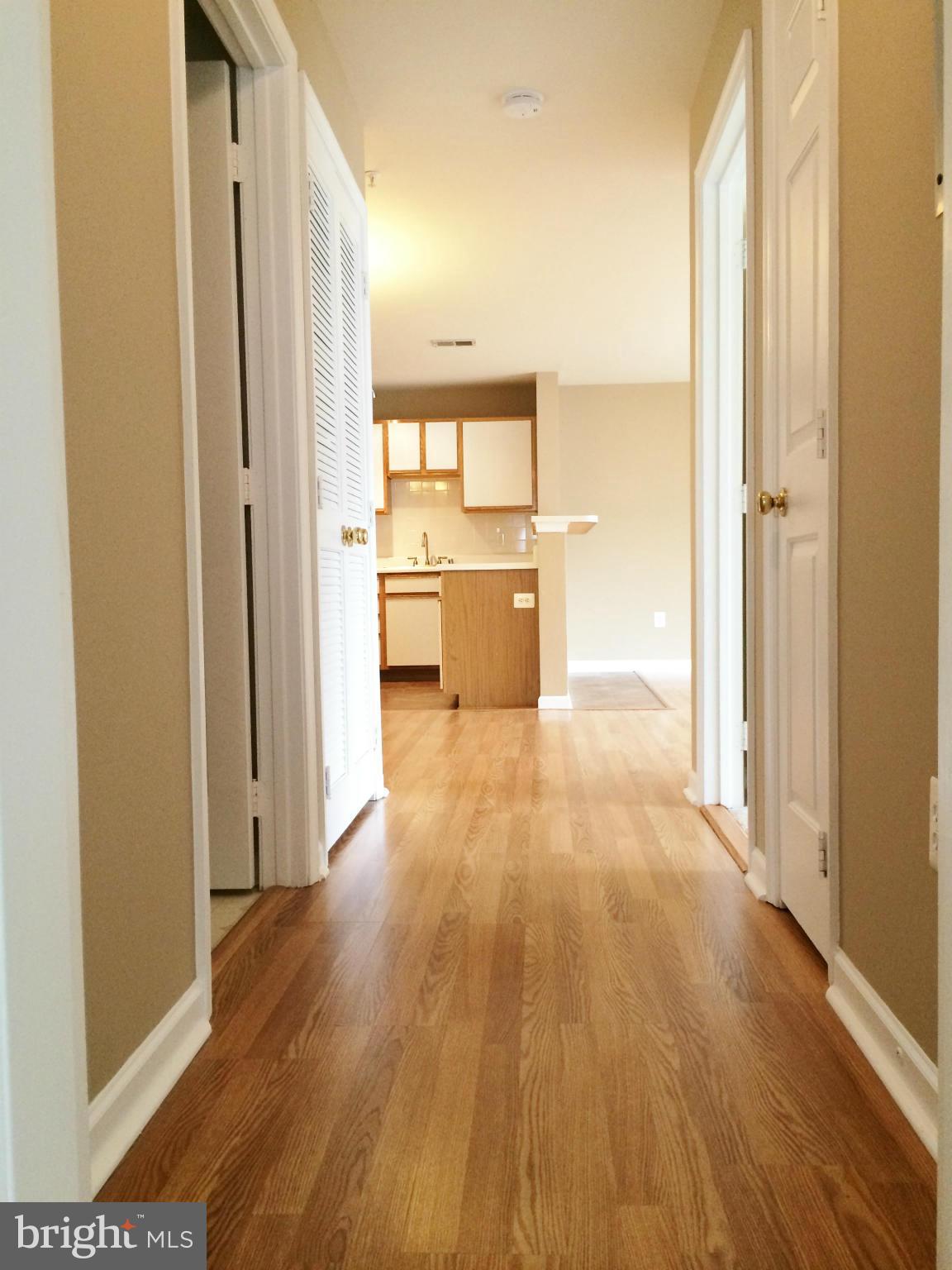 635 Constellation Square Southeast, Unit E Leesburg, VA 20175 - Photo 19 of 20 a view of a kitchen with a refrigerator and a stove
