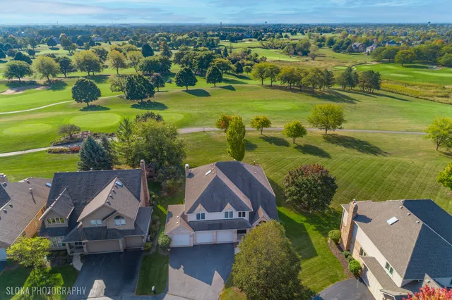 an aerial view of a house with a garden