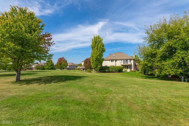 a view of a house with a big yard