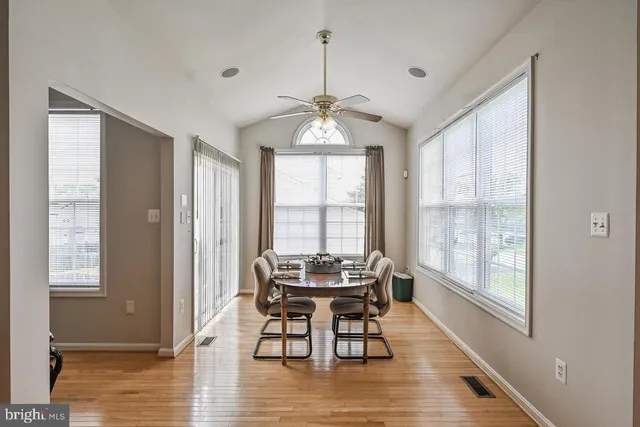 a dining room with furniture window wooden floor