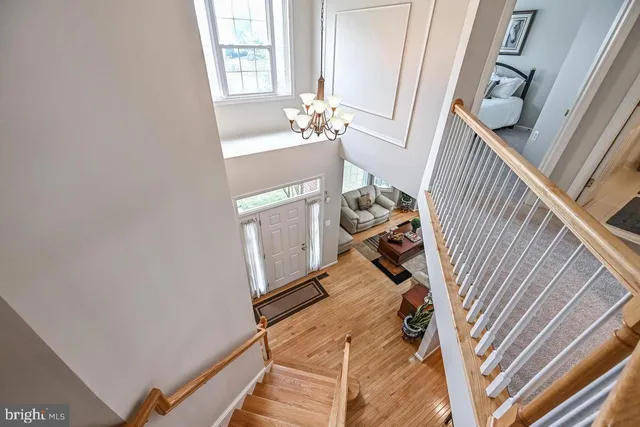 a view of a hardwood floor and staircase