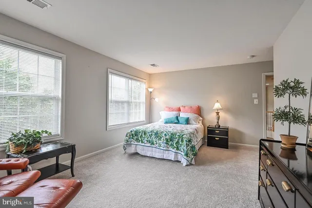 a bedroom with furniture and a bed