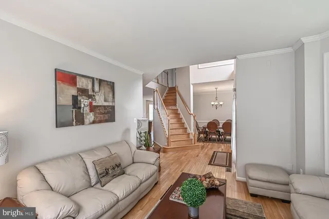 a living room with furniture and white walls