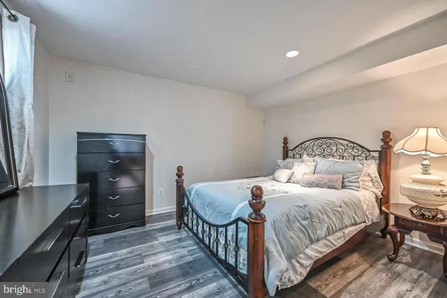a bedroom with a bed and a dresser