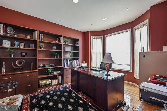 a room with furniture and a book shelf