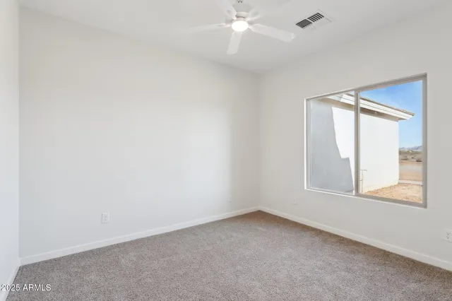 a bathroom with a sink vanity granite tub shower and a mirror