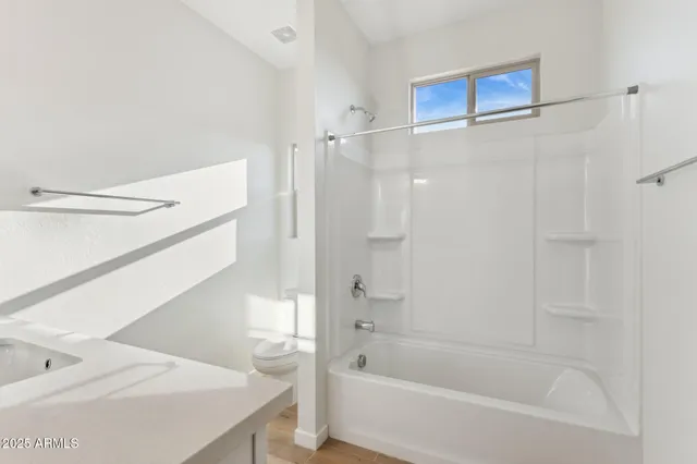 an empty room with a bathroom