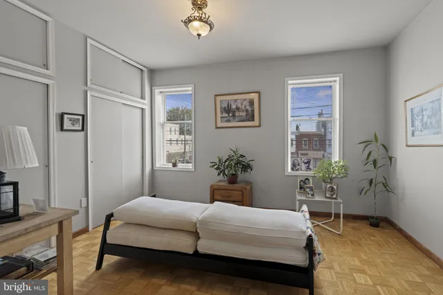 a bedroom with a bed and a table in it