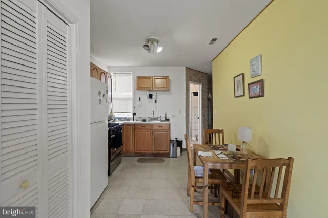 a view of a dining room with furniture and window