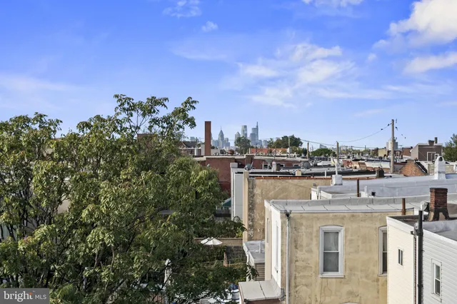 a view of a city with tall buildings