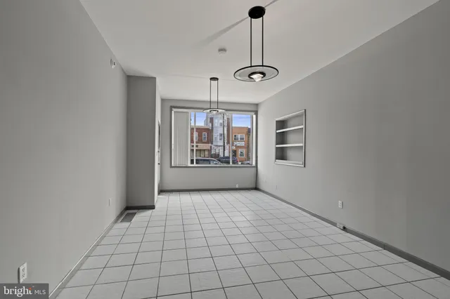 a view of an empty room with windows