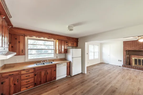 a kitchen with granite countertop a sink and a window