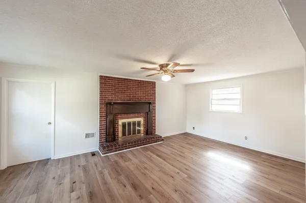 a view of a fireplace with wooden door