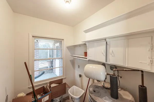 a bedroom with two beds and a window