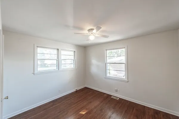 a view of yard with swimming pool and green space