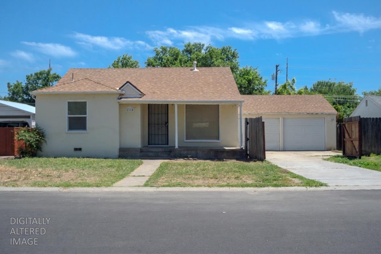 214 Ferguson Avenue Modesto, CA 95354 - Photo 1 of 14 a house that has a large tree in front of it