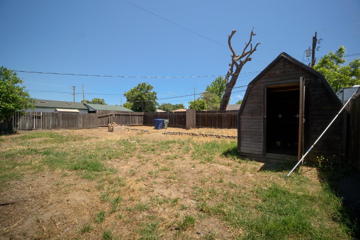 214 Ferguson Avenue Modesto, CA 95354 - Photo 13 of 14 a front view of a house with a yard