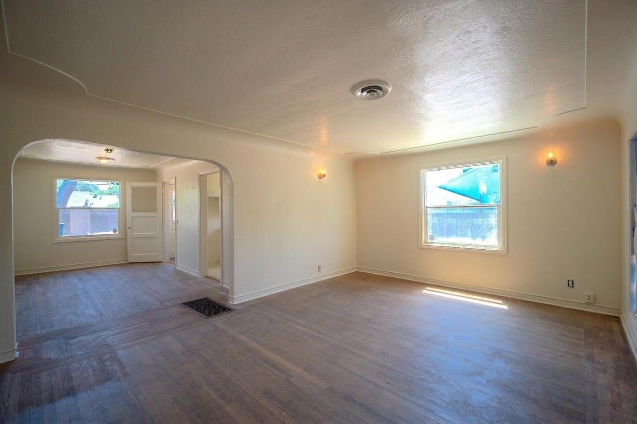 214 Ferguson Avenue Modesto, CA 95354 - Photo 4 of 14 an empty room with window