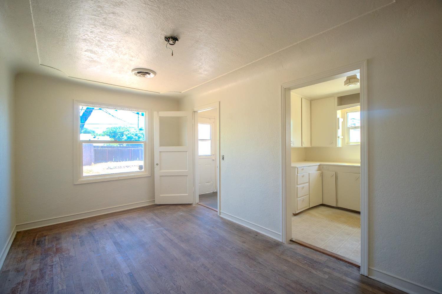 214 Ferguson Avenue Modesto, CA 95354 - Photo 6 of 14 a view of an empty room and window