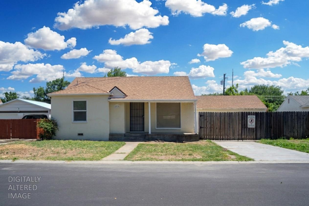 214 Ferguson Avenue Modesto, CA 95354 - Photo 8 of 14 a view of a house with a yard