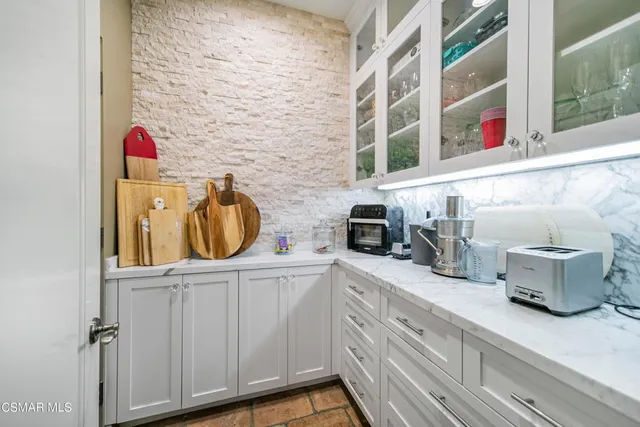 a bedroom with a bed and a mirror