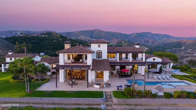 a front view of a building with garden