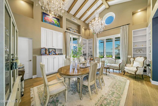 a view of a kitchen with sink and wooden floor