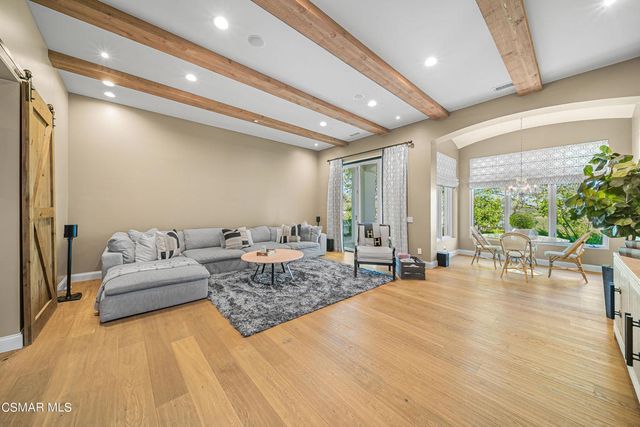 a bed room with a bed and a television