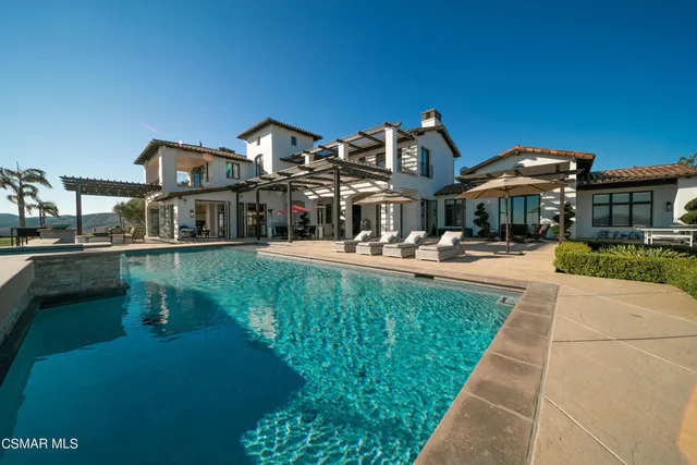 an aerial view of a house with a garden