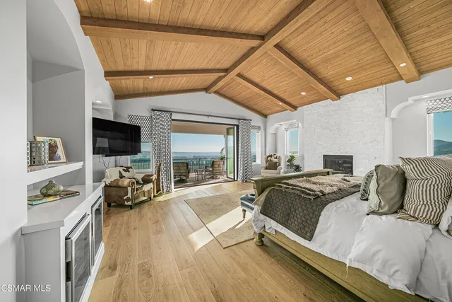 a view of an entryway with wooden floor and furniture