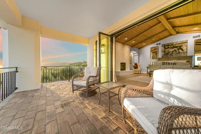 a white tub sitting in a room next to a window