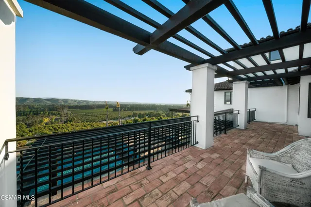a bathroom with a granite countertop toilet sink and mirror