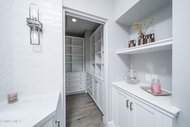 an aerial view of residential houses with outdoor space and river