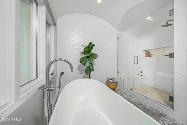 a swimming pool with outdoor seating and yard