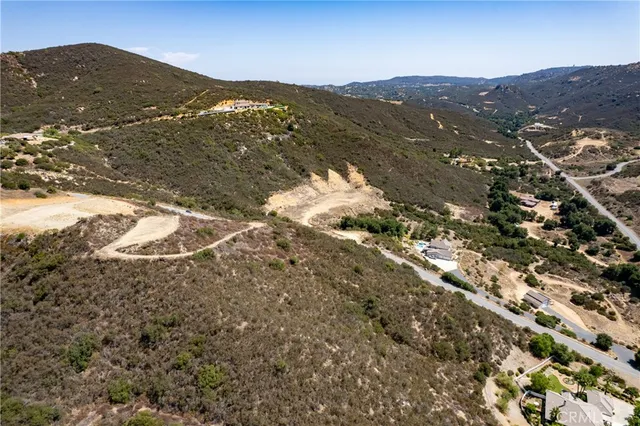 a view of a field with a mountain in the background