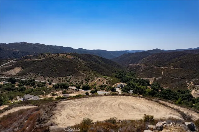a view of multiple houses with a street