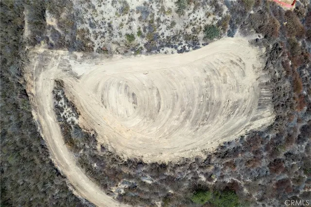 a view of a road with a snow in the background