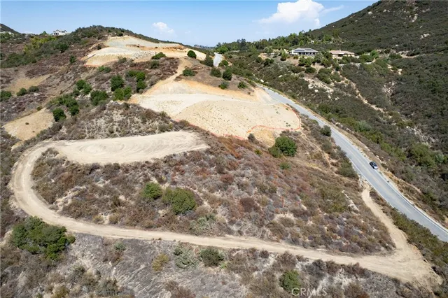 a view of a yard with snow on the road