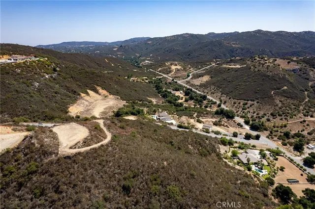 a view of a mountain range with mountains