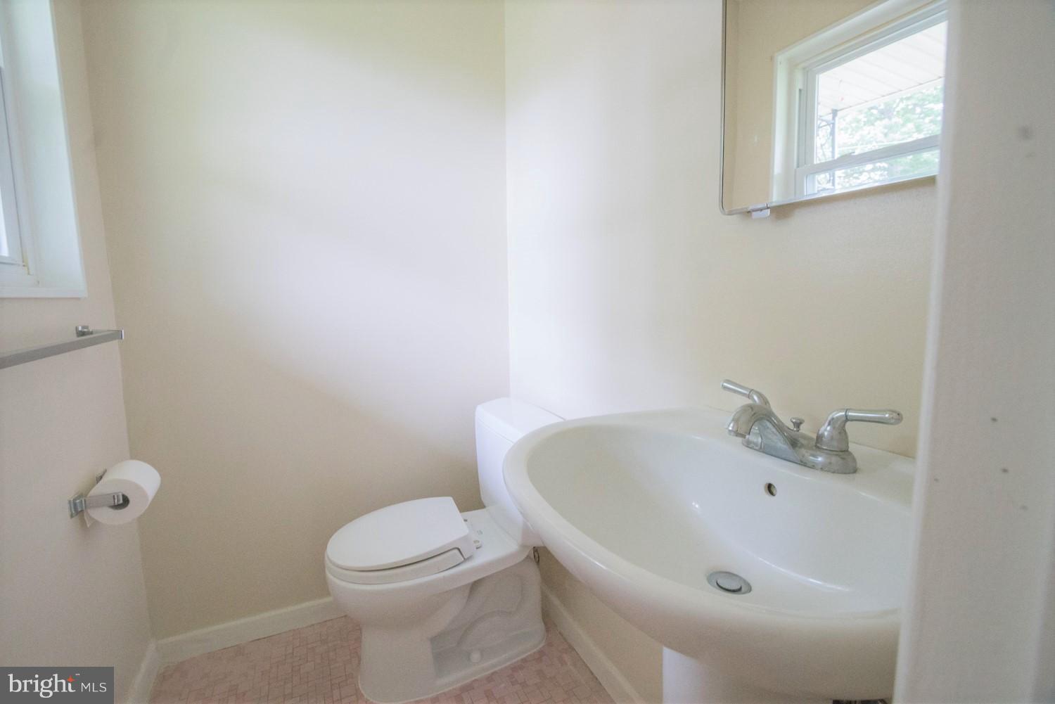 3930 Joliet Street Silver Spring, MD 20906 - Photo 16 of 28 a white bath tub sitting next to a white toilet