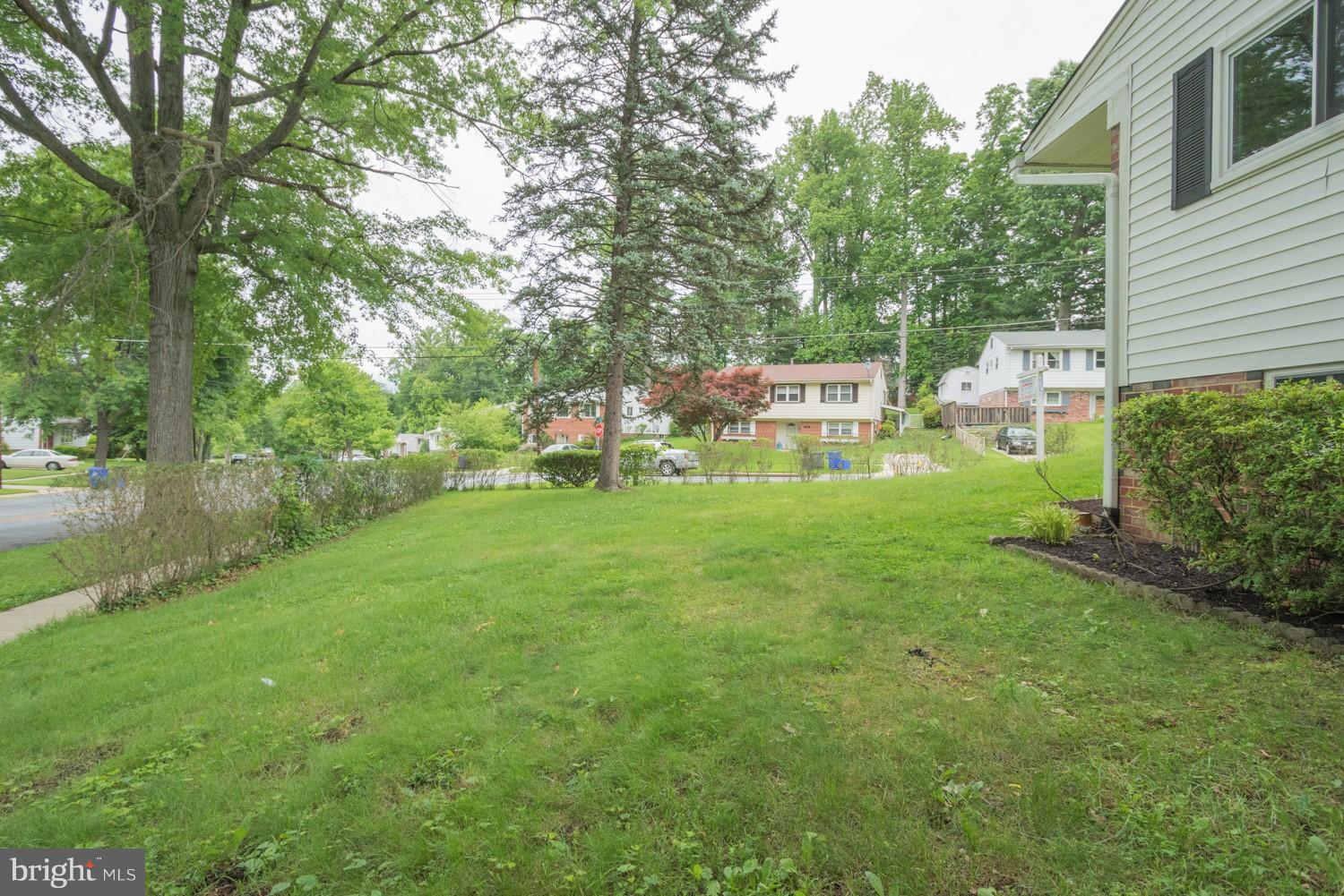 3930 Joliet Street Silver Spring, MD 20906 - Photo 3 of 28 a backyard of a house with table and chairs