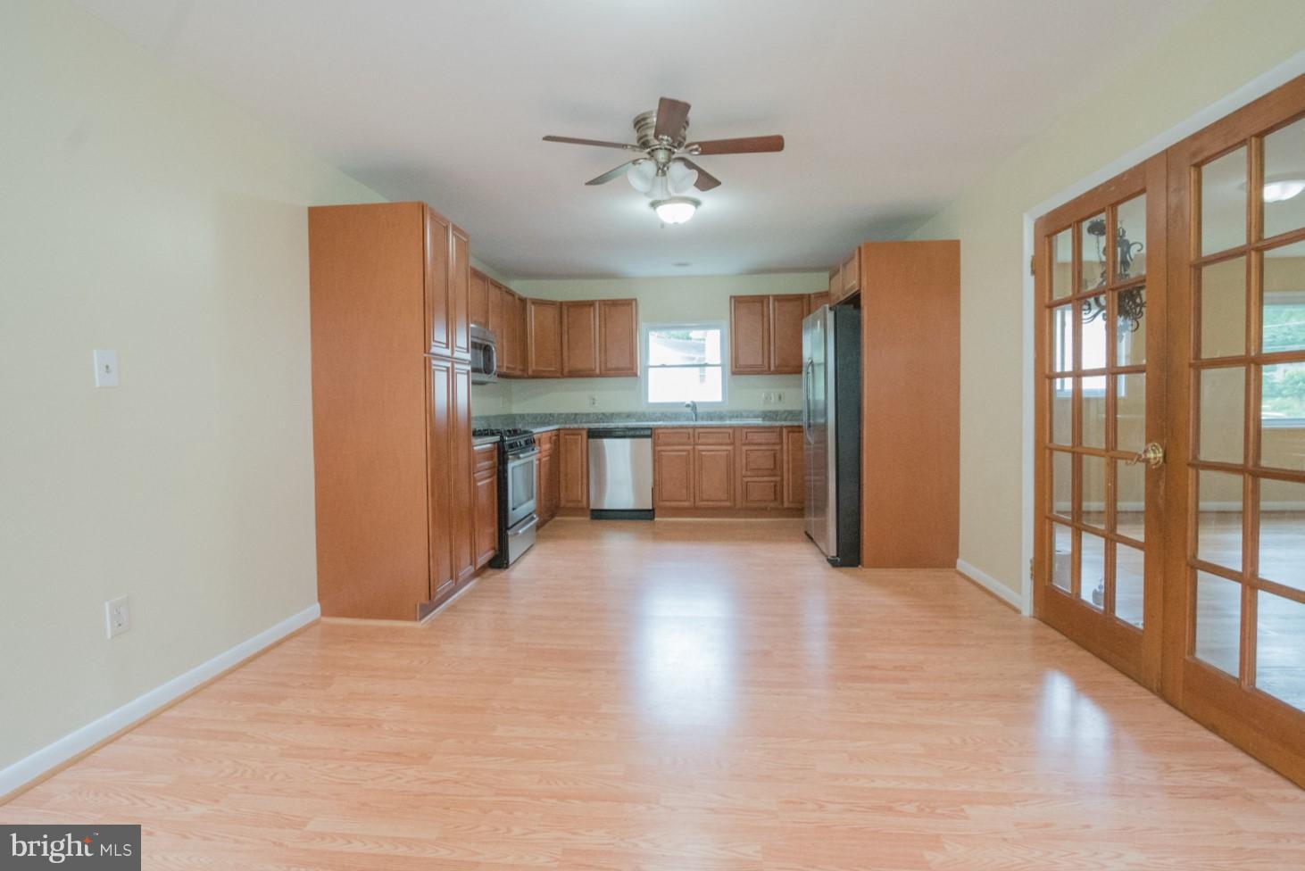 3930 Joliet Street Silver Spring, MD 20906 - Photo 5 of 28 a view of a kitchen with a sink and refrigerator