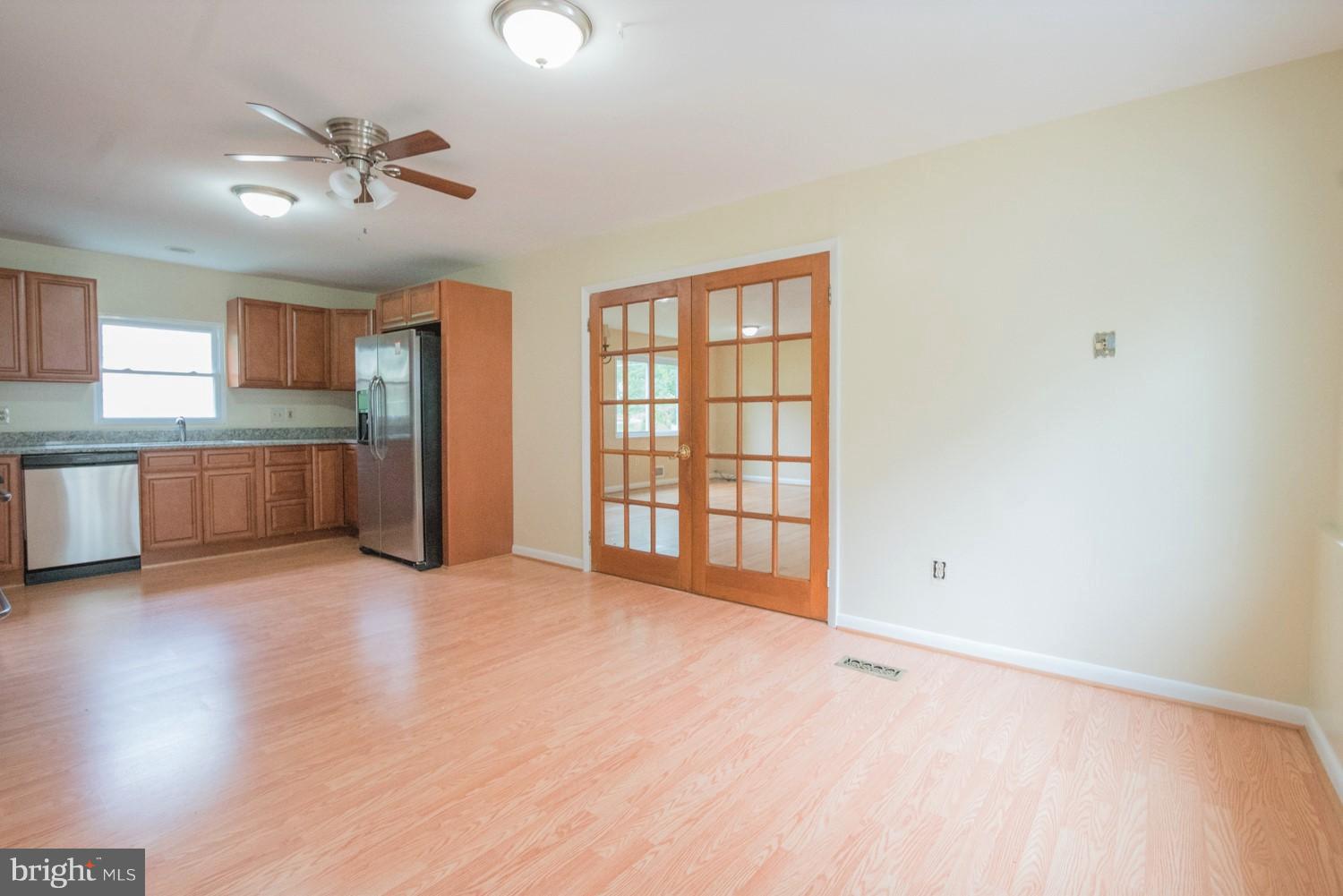 3930 Joliet Street Silver Spring, MD 20906 - Photo 7 of 28 a view of an empty room with a window and wooden floor