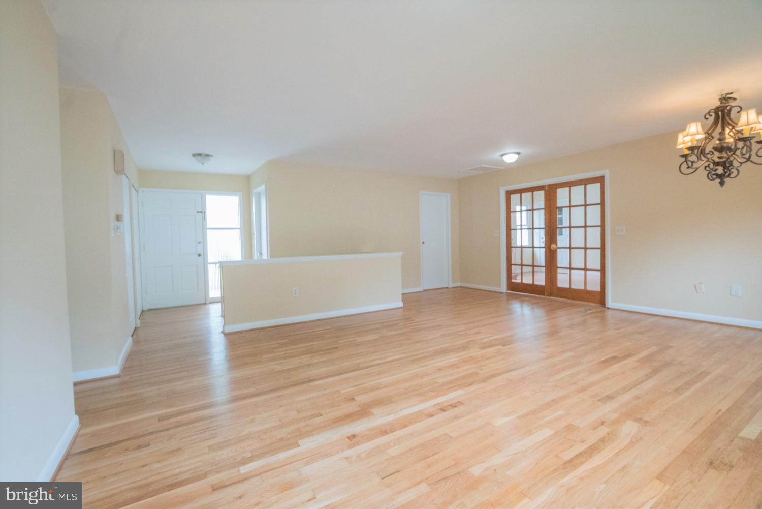 3930 Joliet Street Silver Spring, MD 20906 - Photo 8 of 28 a view of an empty room with wooden floor and a window