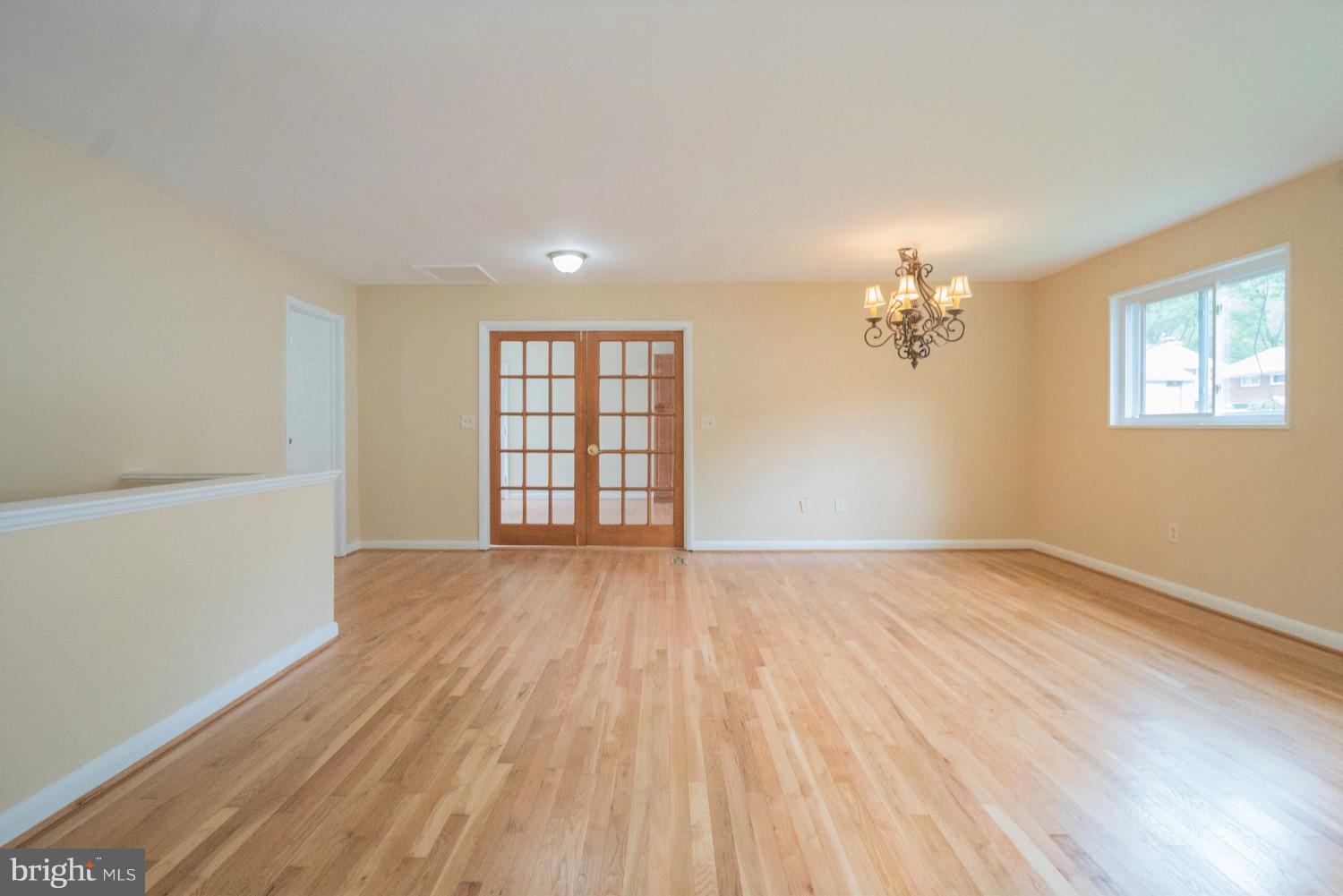 3930 Joliet Street Silver Spring, MD 20906 - Photo 9 of 28 a view of an empty room with a window and wooden floor