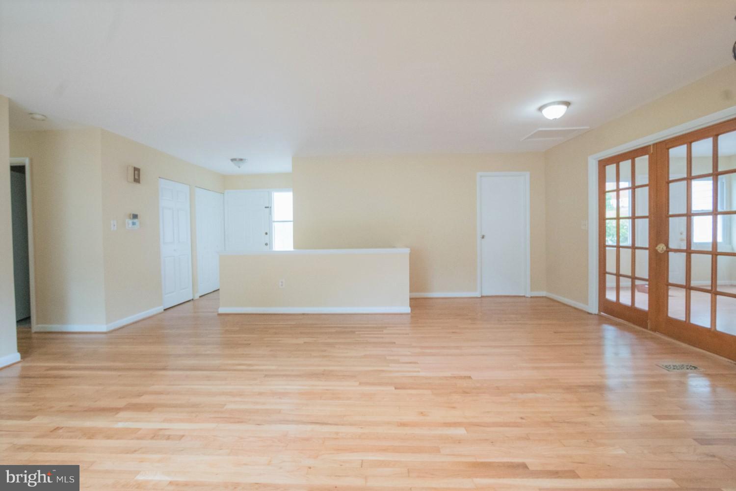 3930 Joliet Street Silver Spring, MD 20906 - Photo 10 of 28 a view of an empty room with wooden floor and a window