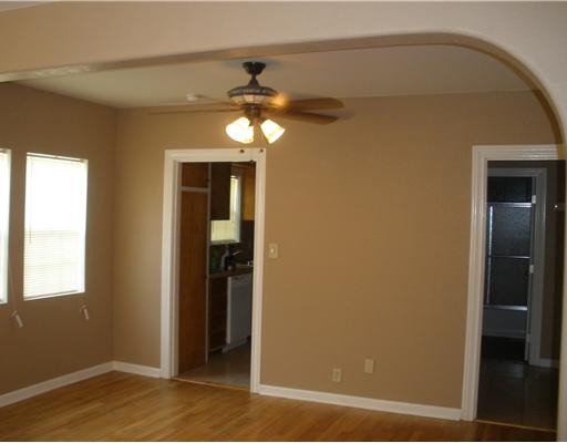1810 3rd Street Corpus Christi, TX 78404 - Photo 5 of 10 an empty room with chandelier fan