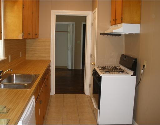 1810 3rd Street Corpus Christi, TX 78404 - Photo 6 of 10 a kitchen with a sink and a refrigerator