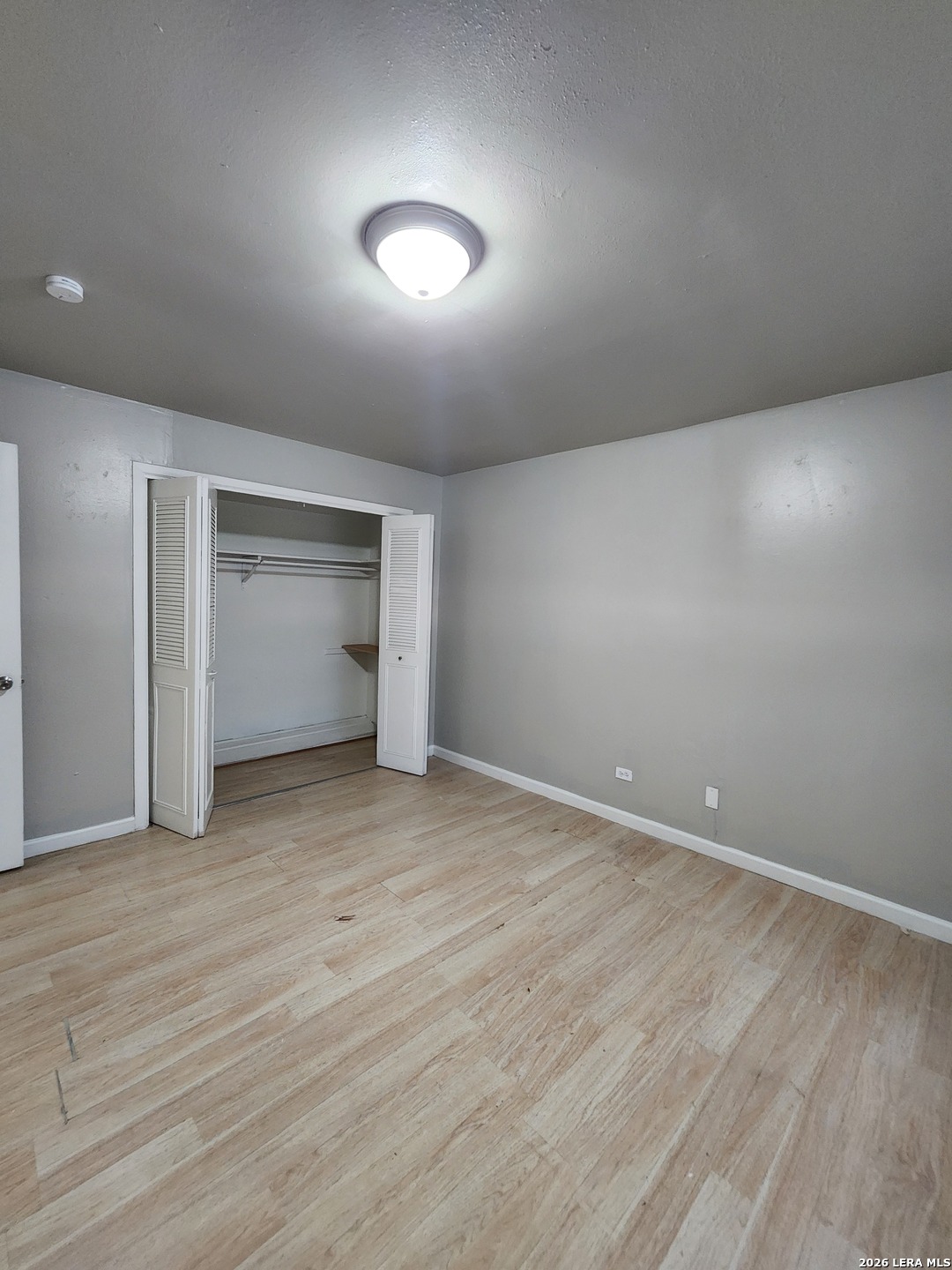 615 Vance Jackson Road, Unit 204 San Antonio, TX 78201 - Photo 12 of 14 a view of an empty room and a kitchen